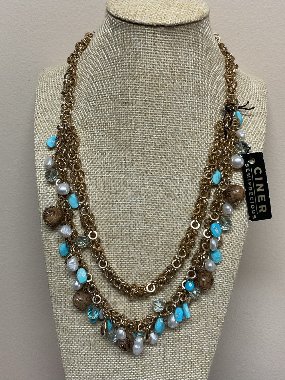 Ciner Gold Multi-Strand Necklace with Turquoise, Brown and Faux Pearl Accents.